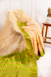 Graceful Pastel Peach Silk Cotton Saree with Green Zari Border