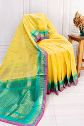 Sunshine Yellow Cotton Saree with Contrast Green Border & Floral Lace Detailing