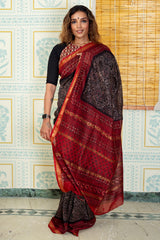 Elegant Black Ajrakh Inspired Printed Cotton Saree with Rich Maroon Pallu & Traditional Golden Border