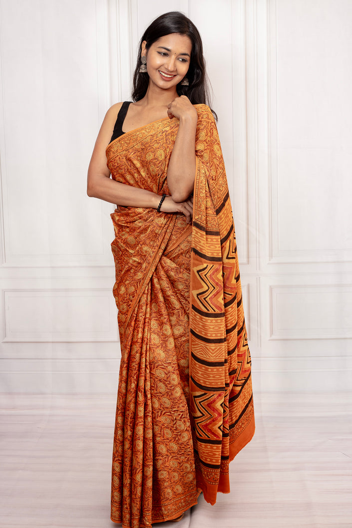 Rust Orange Ajrakh Saree with Bold Pallu Design