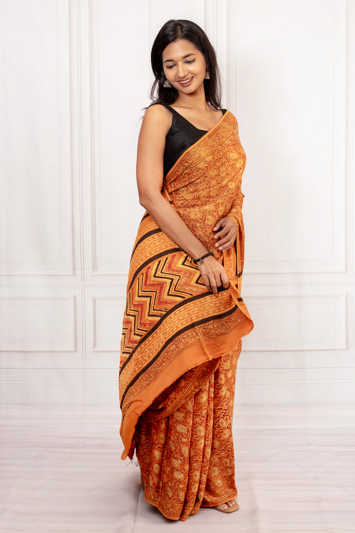 Rust Orange Ajrakh Saree with Bold Pallu Design