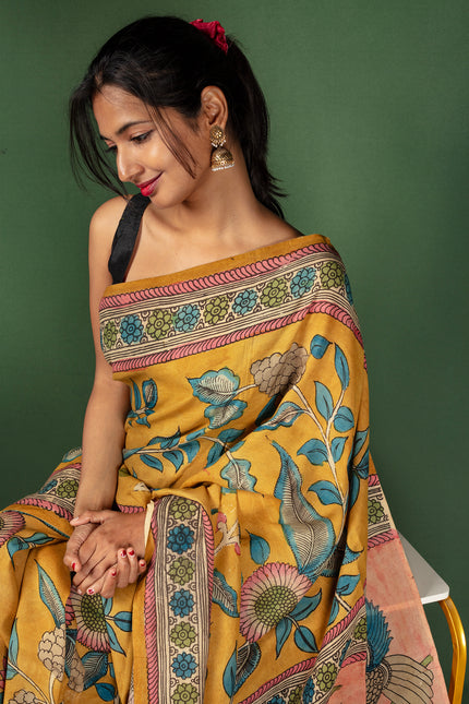 Handcrafted Kalamkari Saree with Majestic Peacock Pallu & Floral Motif Body