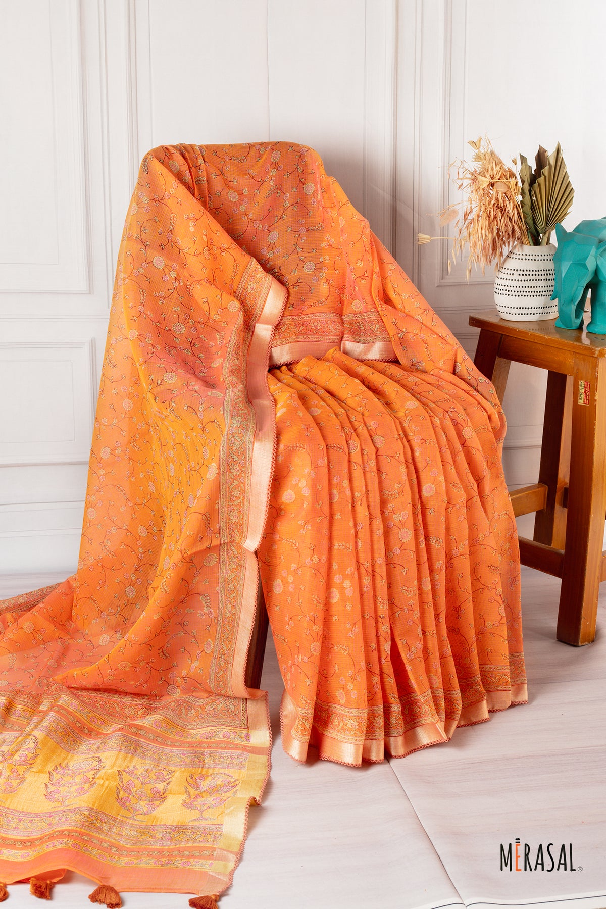 Burnt Orange Chanderi Cotton Saree with Floral Motifs and Gold Zari Border